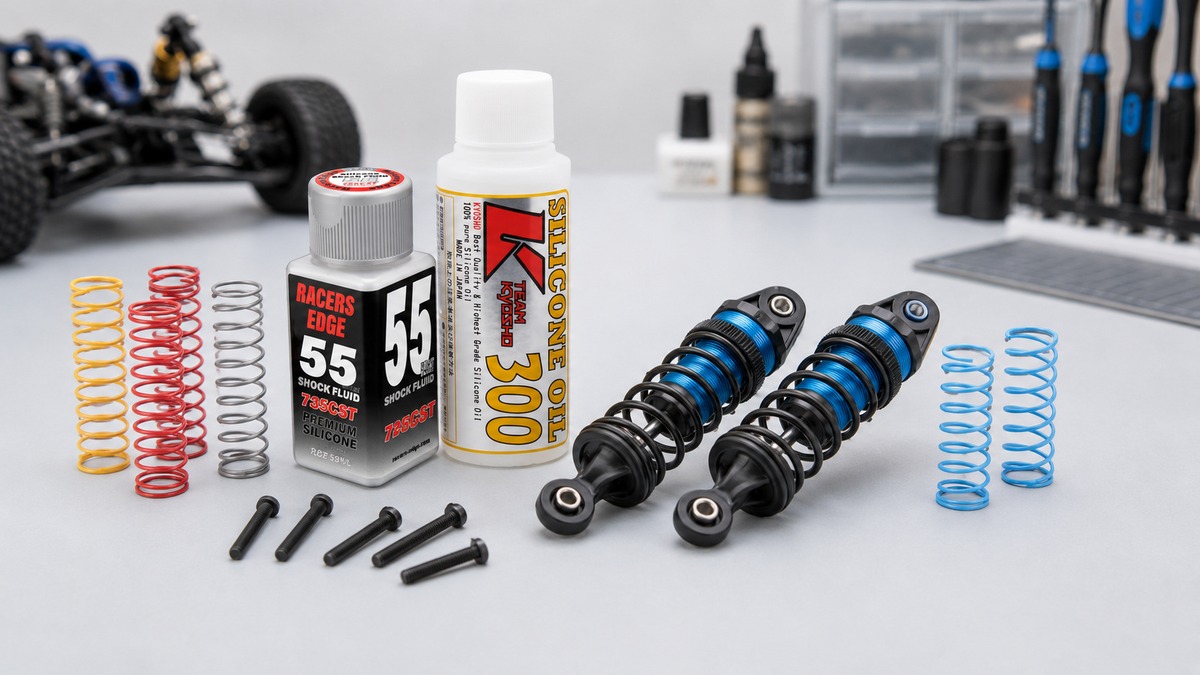 RC shocks and shock oil bottles on a bench